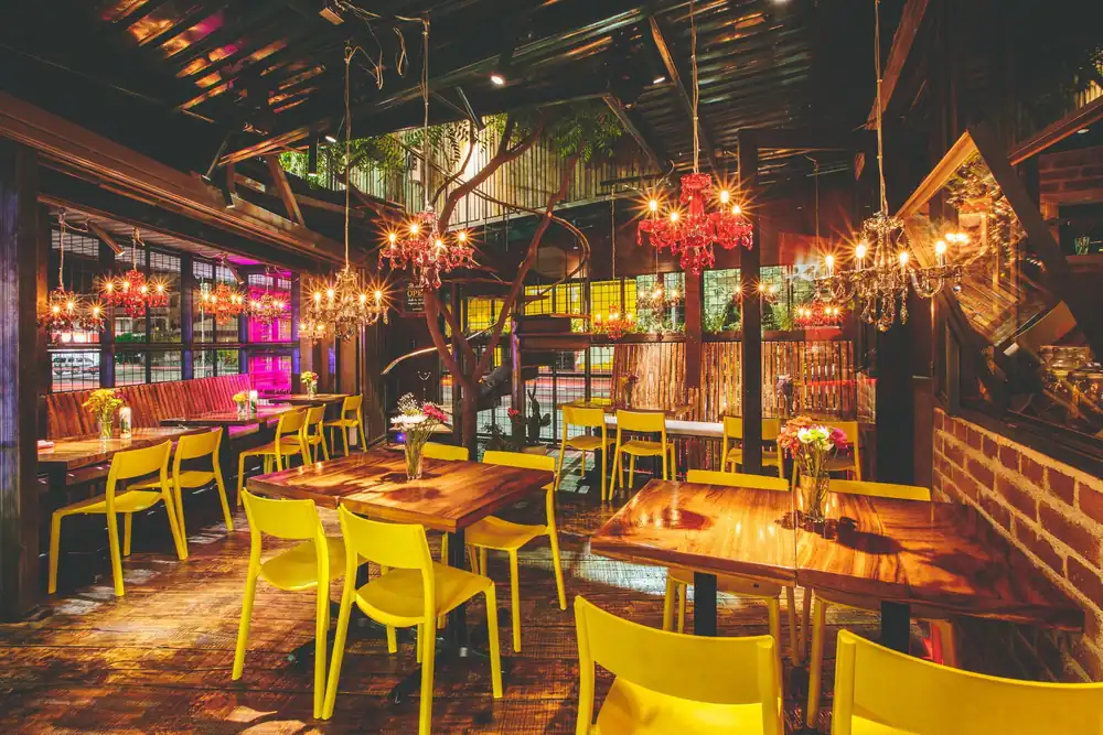 Gardens and dining tables at Outpost Cabo